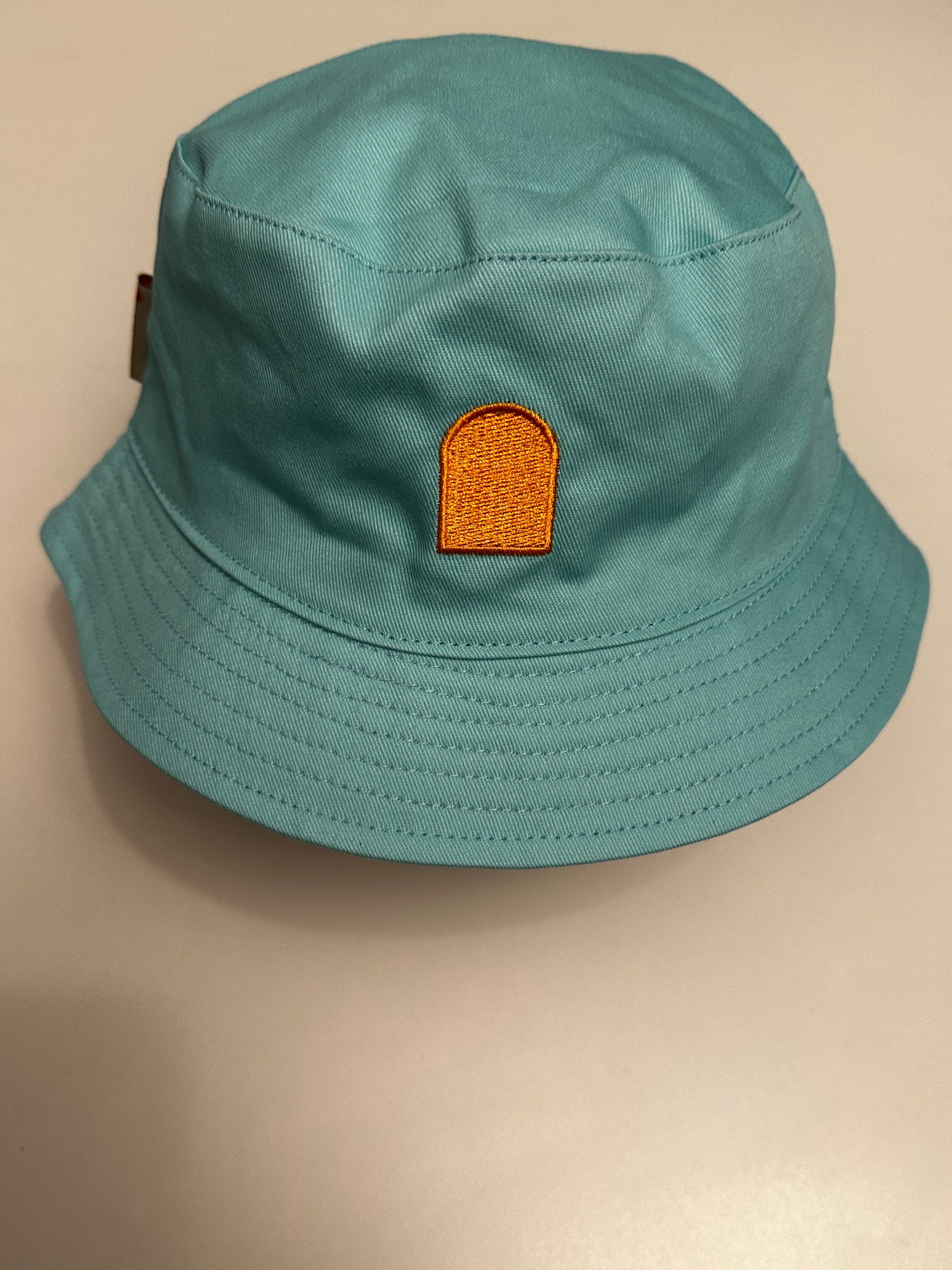 Teal bucket hat reversible tan theselected